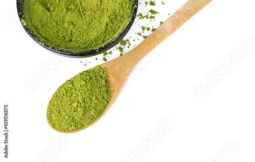 Matcha green tea powdered with wooden spoon isolated on white background