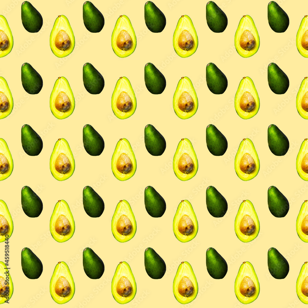 Seamless Pattern of Halves of Ripe Avocado on light orange background, Healthy oily food, Keto diet Seamless Pattern of Halves of Ripe Avocado on light orange background, Healthy oily food, Keto diet