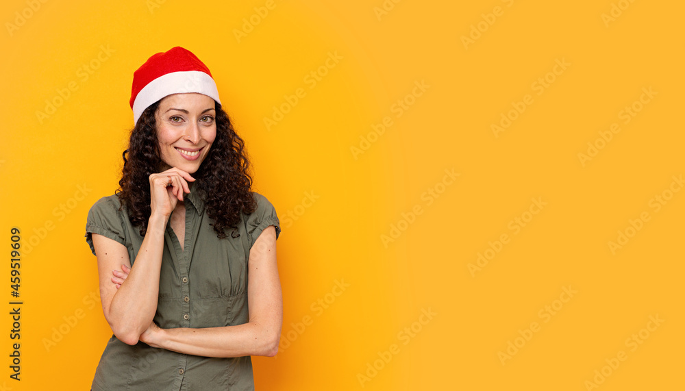 Woman with a Christmas hat smiling Woman with a Christmas hat smiling