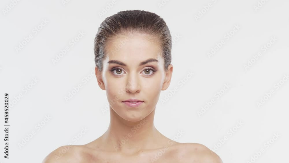 Beauty portrait of young, attractive and healthy woman. Brunette girl over white background. Natural female face. Beauty portrait of young, attractive and healthy woman. Brunette girl over white background. Natural female face.