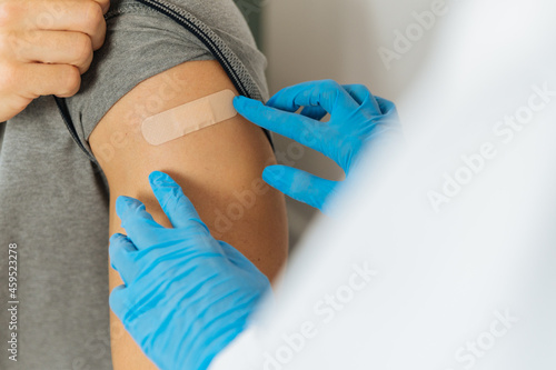 Crop doctor sticking patch after vaccination