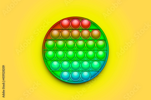 Rainbow Trendy Pop it fidget toy on a empty background. Vector..