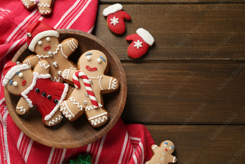 Delicious Christmas cookies on wooden table, flat lay. Space for text