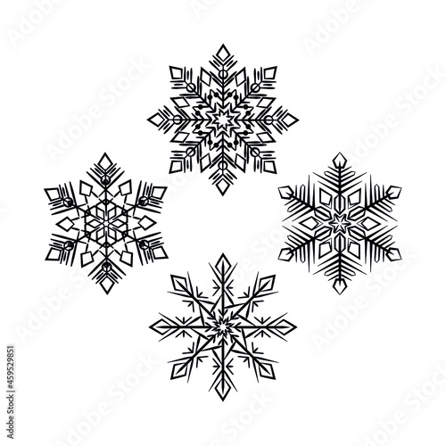 A set of richly decorated snowflakes. Black snowflakes on a white background. Templates for decorating postcards, Christmas souvenirs, printing posters. Symmetrical snow flakes. A vector image.