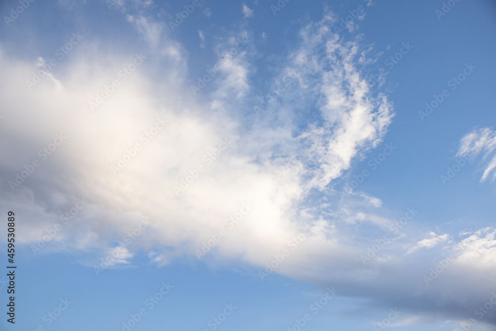 Fototapeta premium Amazing clouds hanging in the blue sky. Wonderful sunset and a better sunrise with beautiful clouds with a colorful sky.