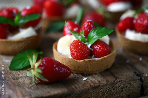 Delicious tartlets with strawberries and banana. Healthy dessert.