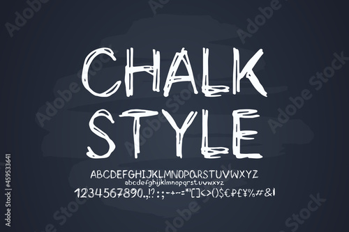 White chalky font on blackboard background. Original hand-drawn uppercase and lowercase letters, numbers, sketch style