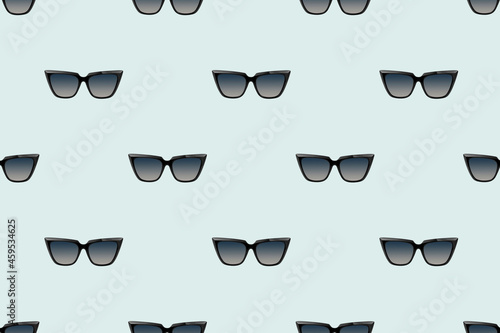 Glasses pattern background. Black cat eye sunglasses isolated. Minimal concept.