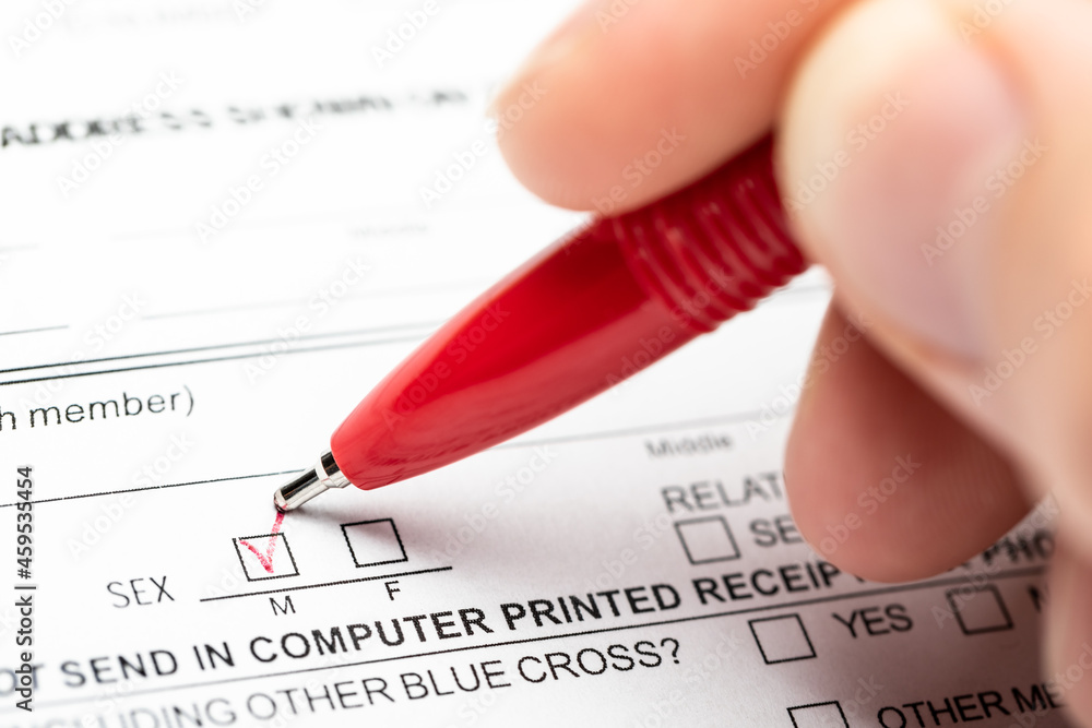 Person marking gender checkbox in a form Person marking gender checkbox in a form