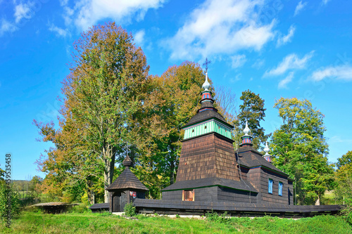 Orthodox wooden church in Bartne village in autumn sunny day, Low Beskids (Beskid Niski), Poland