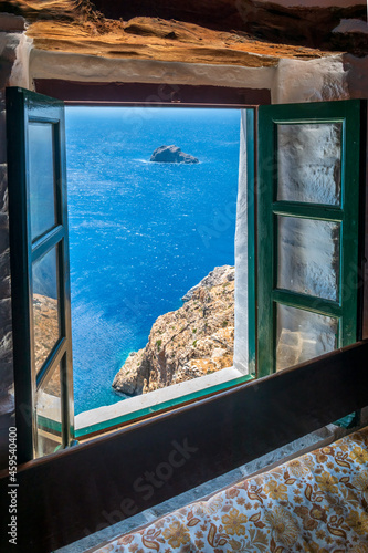 Fotografie view from the famous Hozoviotissa Monastery standing on a rock over the Aegean sea in Amorgos island, Cyclades, Greece