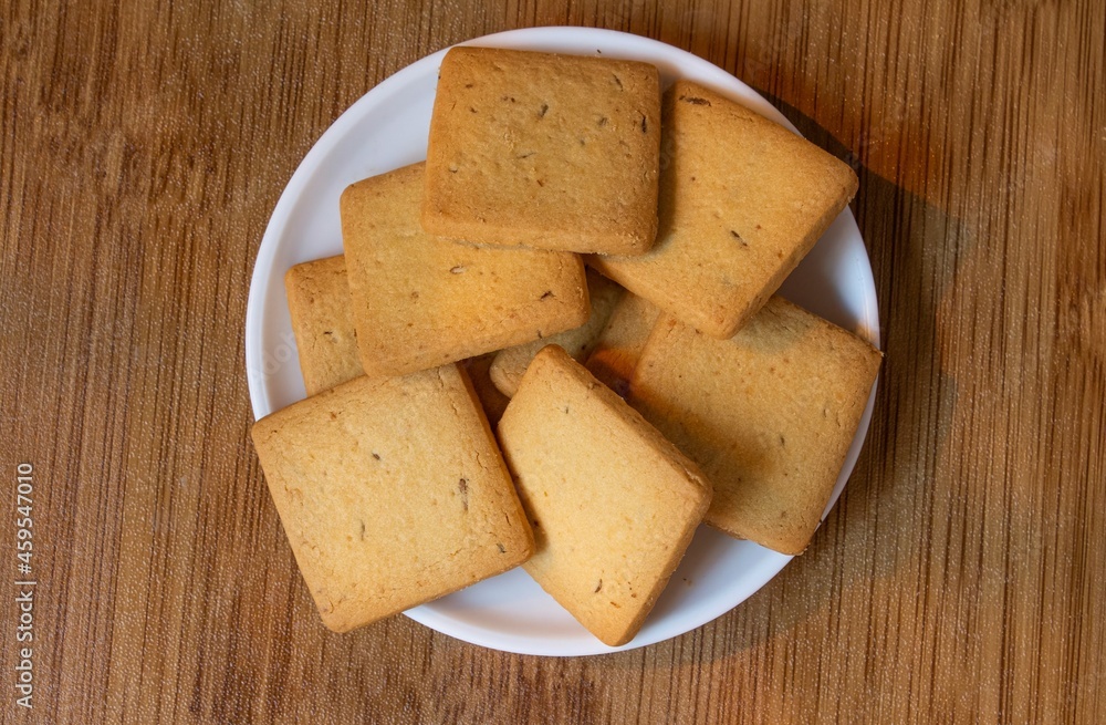 Fototapeta premium wheat biscuits also called food cracker famous as chai biscuit in india and pakistan served with tea mostly displayed in plate top view, selective focus