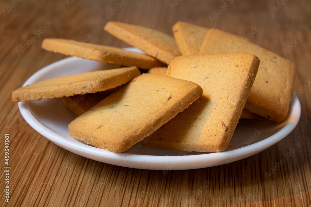 wheat biscuits also called food cracker famous as chai biscuit in india and pakistan served with tea mostly displayed in plate with blurry background, selective focus