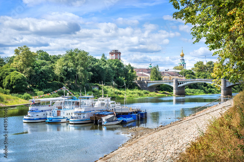 Motor ships at the pier on the river in Vologda on a summer sunny day