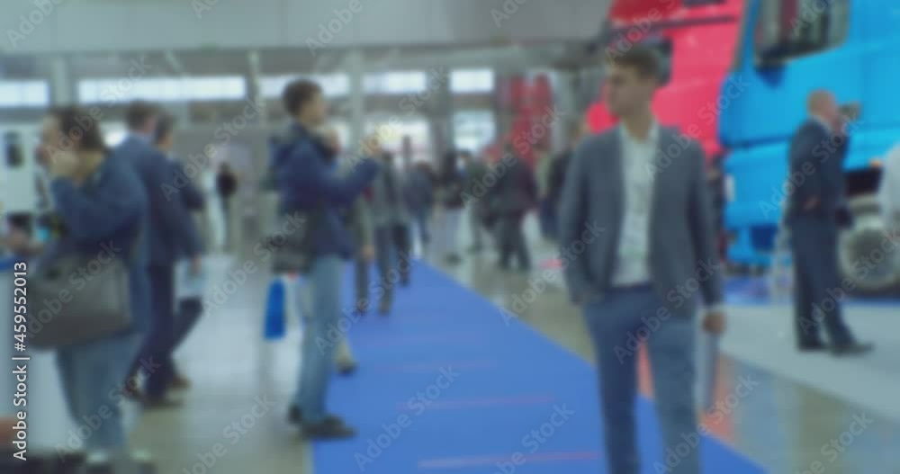 Blurred background on a business theme. Unrecognizable people inside a large bright business center. Blurred background on a business theme. Unrecognizable people inside a large bright business center.