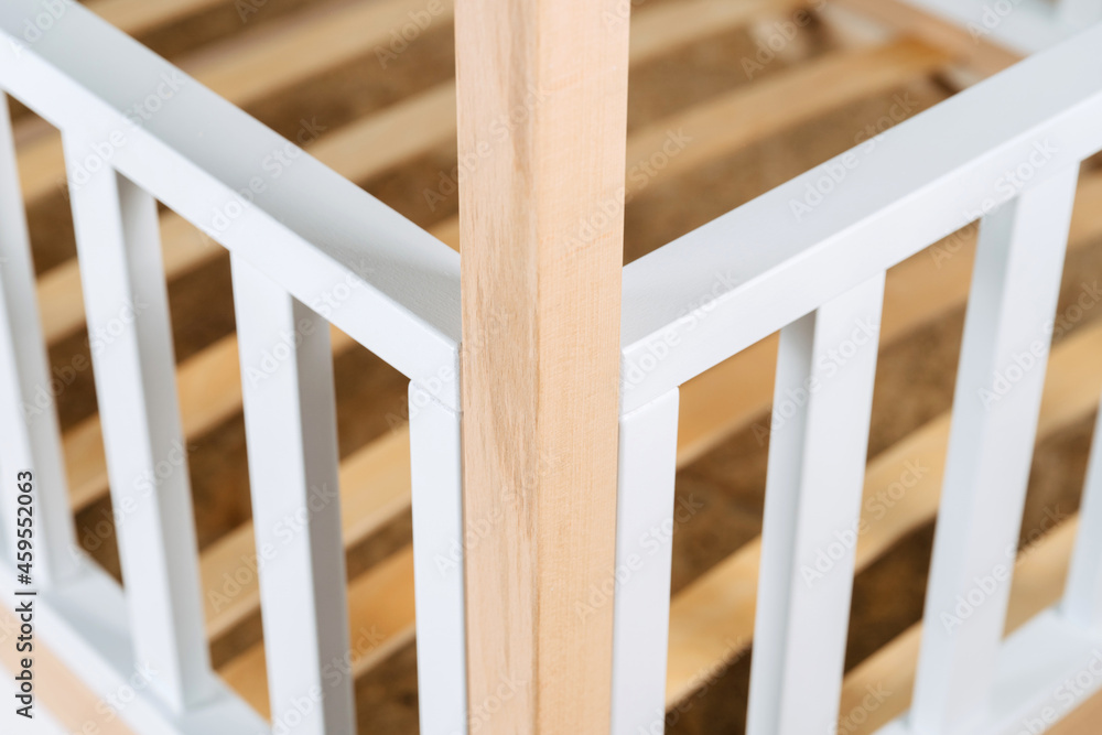 The image of the child's bed, in the frame of the bed legs and drawers.