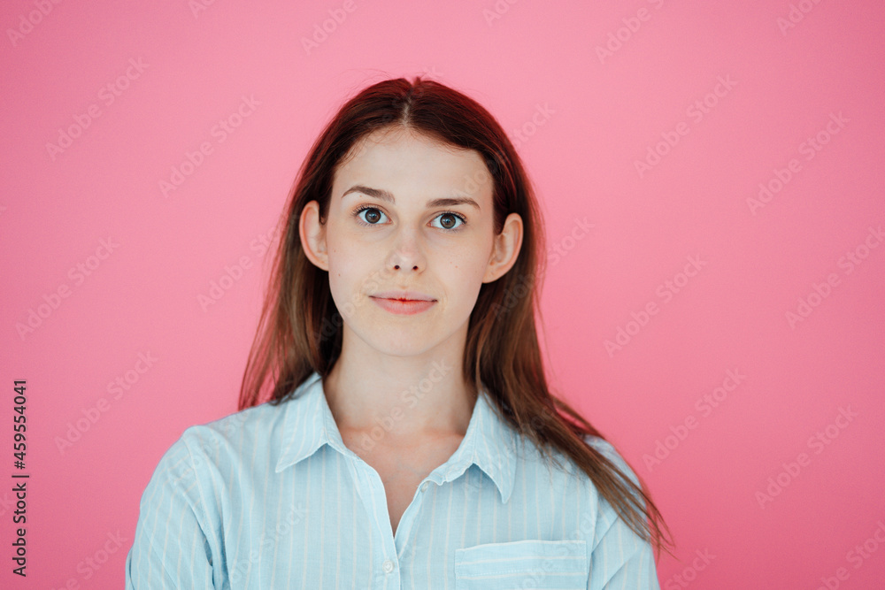 Beautiful woman with brown hair against pink background Beautiful woman with brown hair against pink background