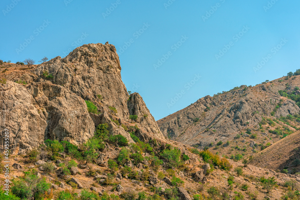 Mountain landscape on a blue sky background Mountain landscape on a blue sky background