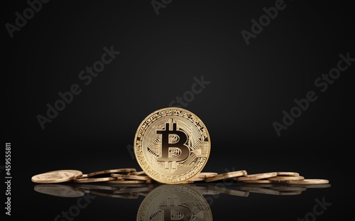 Classic gold bitcoin on dark background photo