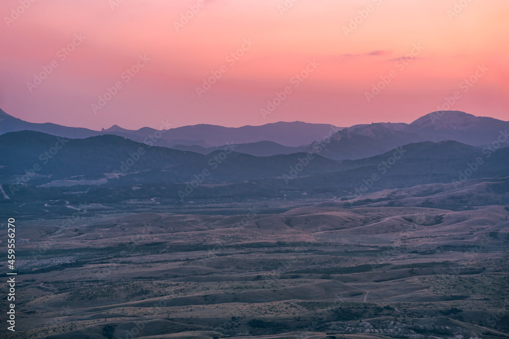 Scenic mountain landscape at sunset. Colorful travel background.
