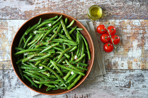 Photos Cooked green beans in a bowl. Healthy food. Vegan food.
