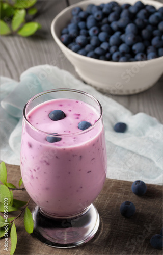 Homemade blueberry yogurt smoothie. Protein shake with berries. Vertical image