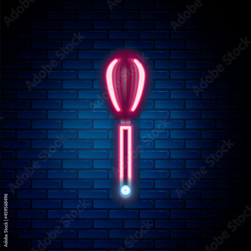 Glowing neon line Kitchen whisk icon isolated on brick wall background. Cooking utensil, egg beater. Cutlery sign. Food mix symbol. Colorful outline concept. Vector