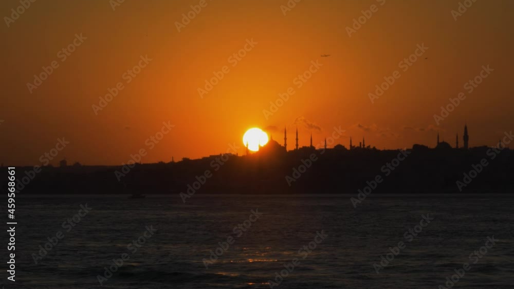 Blue Mosque at sunset with the Marmara Sea reflecting warm evening light Blue Mosque at sunset with the Marmara Sea reflecting warm evening light
