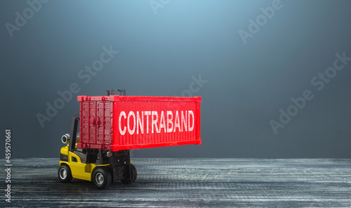 Photos A forklift truck carries a red container contraband