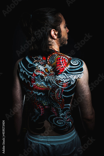 yakuza with dragon tattoo on back
