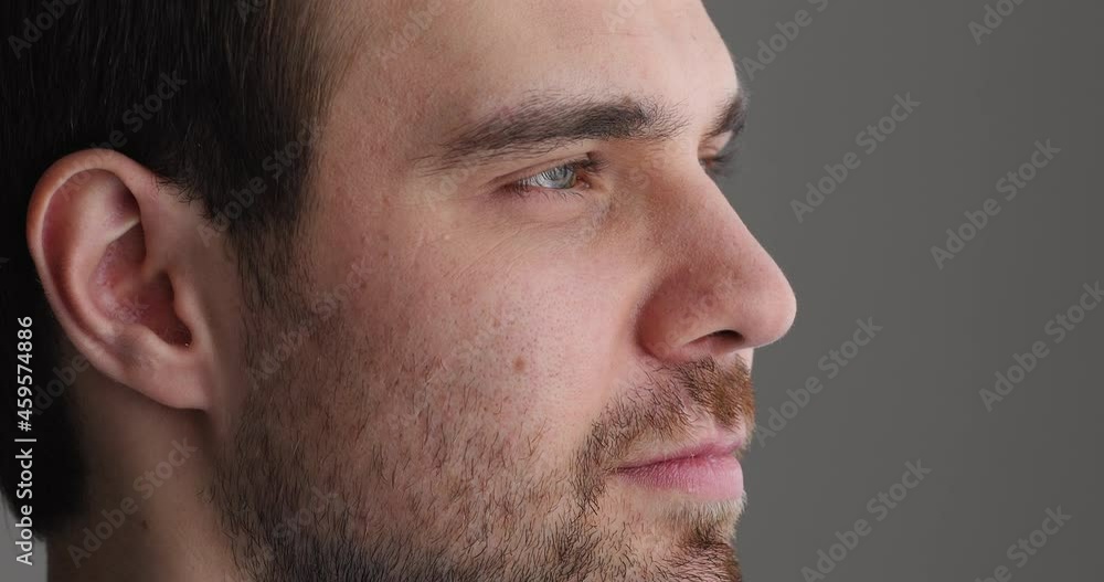 Close up young man looking in distance, visualizing future or daydreaming indoors. Happy male client satisfied with clear vision after eye sight laser correction operation, ophthalmology concept. Close up young man looking in distance, visualizing future or daydreaming indoors. Happy male client satisfied with clear vision after eye sight laser correction operation, ophthalmology concept.