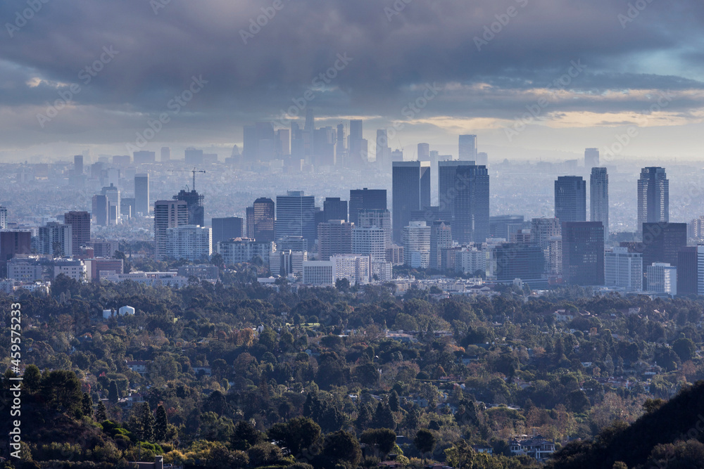 Stormy sky view of Century City with downtown Los Angeles in the background.  