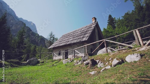 Old Alpine stone cottage with wooden roof