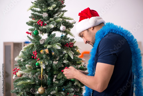 Young man celebrating Christmas at home