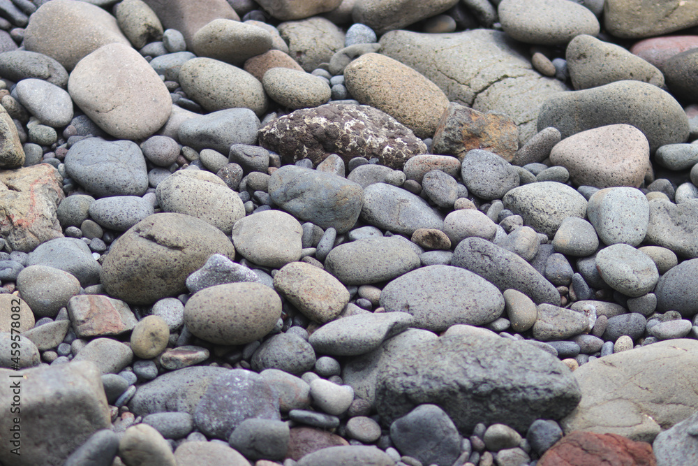 Stacked Beach stones and pebble texture for industrial background Stacked Beach stones and pebble texture for industrial background