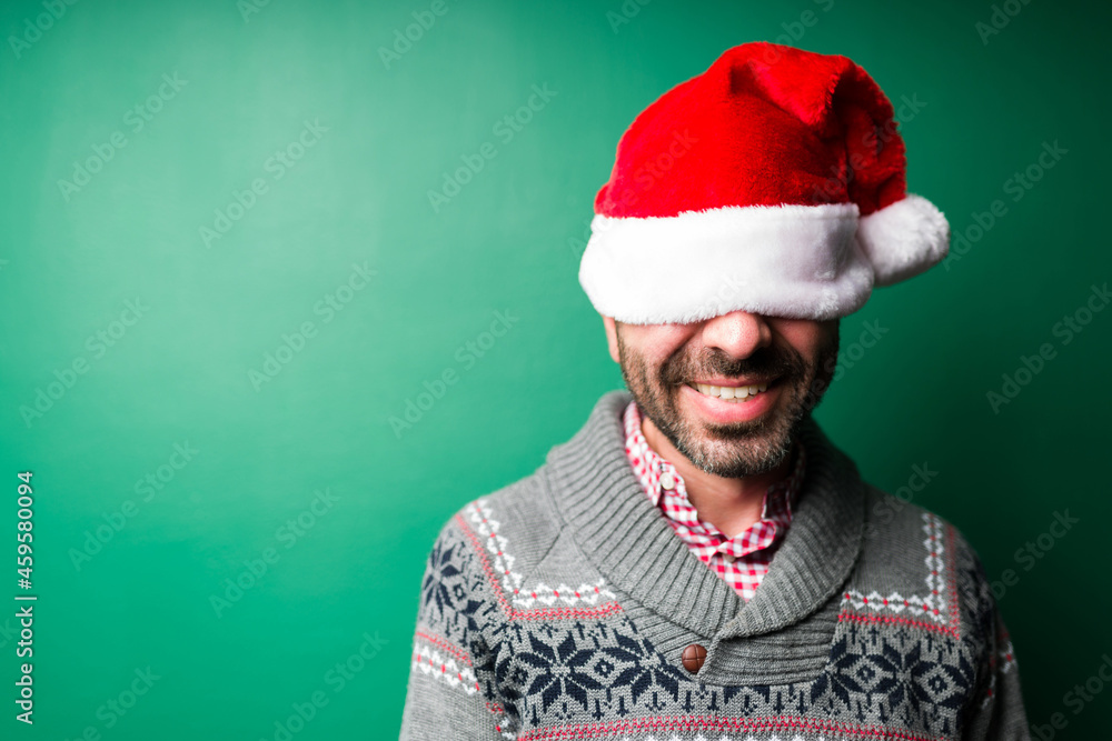 Fun handsome man with a christmas hat Fun handsome man with a christmas hat