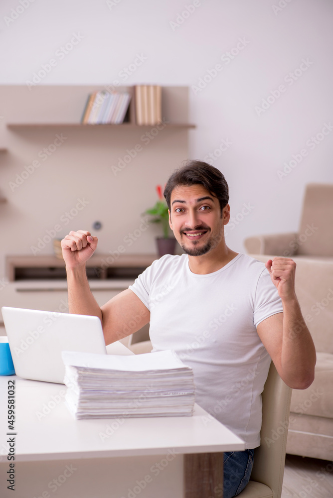 Young male freelancer working from home Young male freelancer working from home