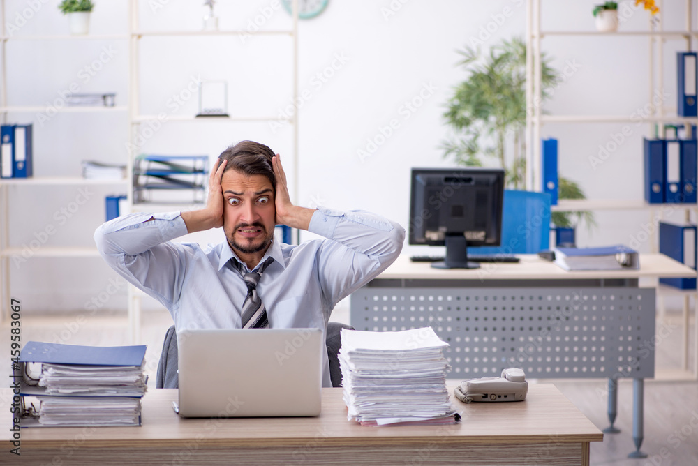 Young businessman employee working in the office Young businessman employee working in the office