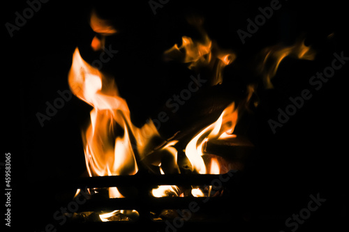 Fire on a black background, firewood, wood burn in a fireplace