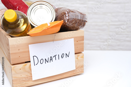 Donation box with food in it for homeless and peeple in need after nature disaster, copy space photo