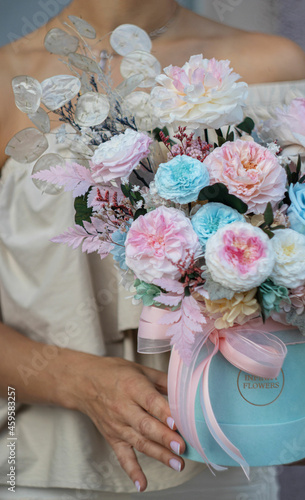 Preserved roses with dried flowers bouquet closeup. Eternal, stabilized rose flower in turquoise colors. Beautiful flowers.