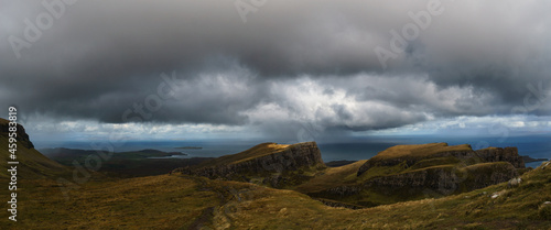 Panorama of moody rocky landscape of landslide Quiraing on a rainy autumn day, Isle of Skye, Scotland