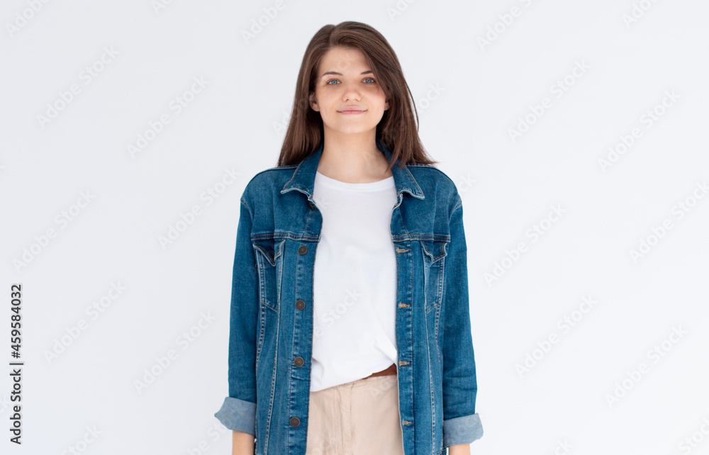 Portrait of young beautiful cute cheerful girl smiling looking at camera over white background. Portrait of young beautiful cute cheerful girl smiling looking at camera over white background.