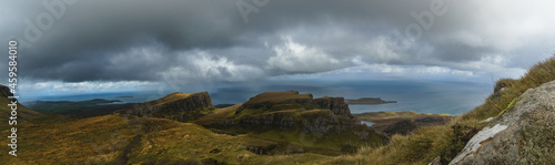Panoramic view over rocky landscape of landslide Quiraing on a dark rainy autumn day, Isle of Skye, Scotland