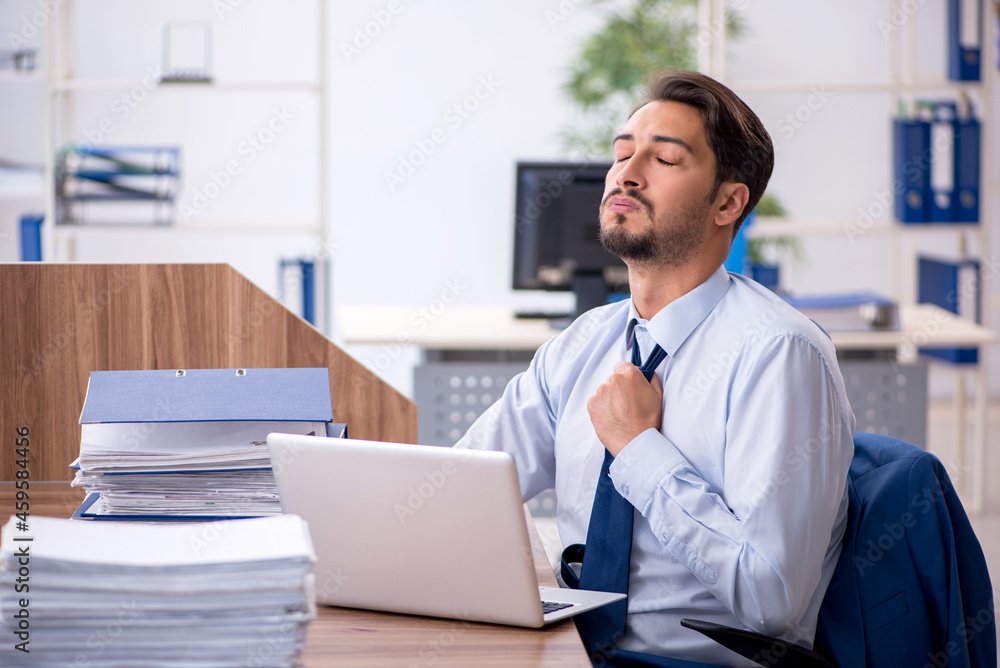 Young businessman employee working in the office Young businessman employee working in the office