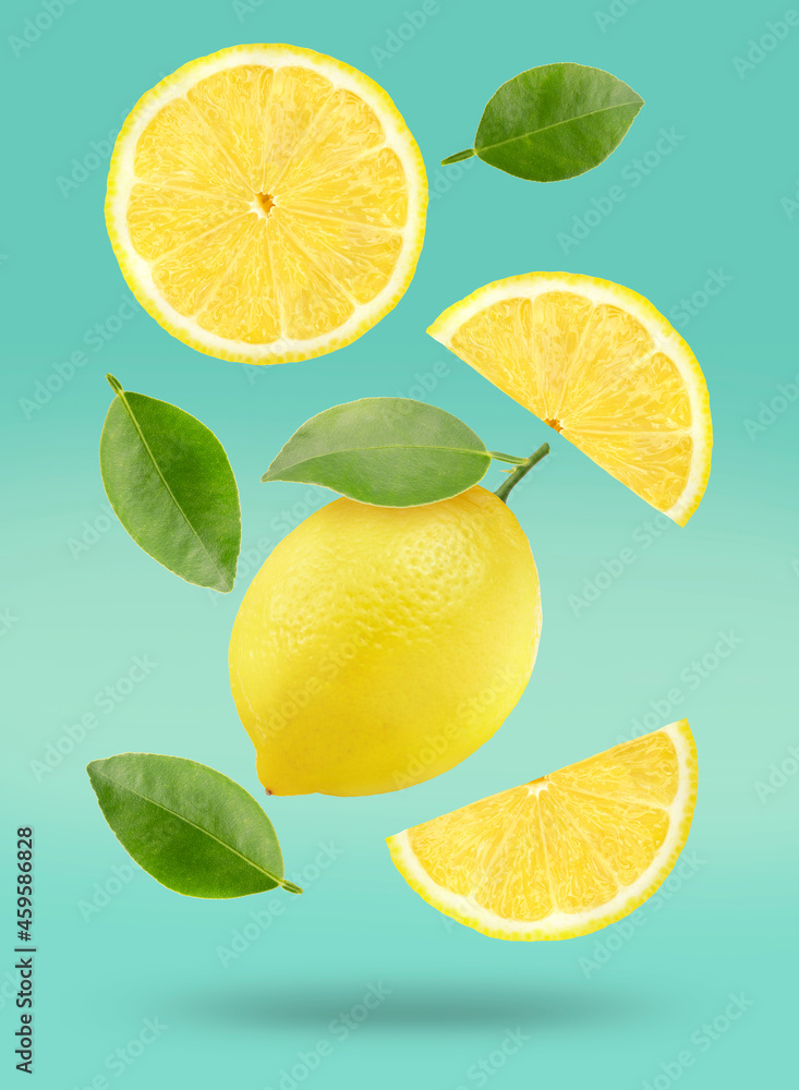 Lemon Fruit with leaves isolated on green background, Fresh Lemon Fruit with slice on green background With clipping path.