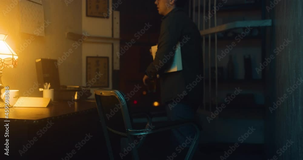 Man sits alone in his apartment, drinks and thinks. Man sits alone in his apartment, drinks and thinks.