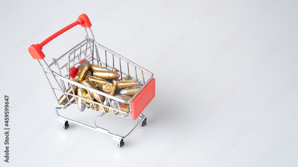 Close-up shot of a 9mm ammunition in a shopping cart, on a white background.