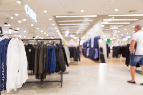 luxury and fashionable brand new on mannequin. interior of cloth store. shopping mall interior.