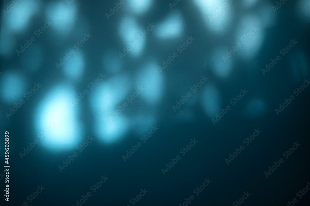 Obraz premium blurred light texture background with shadow on the blue wall